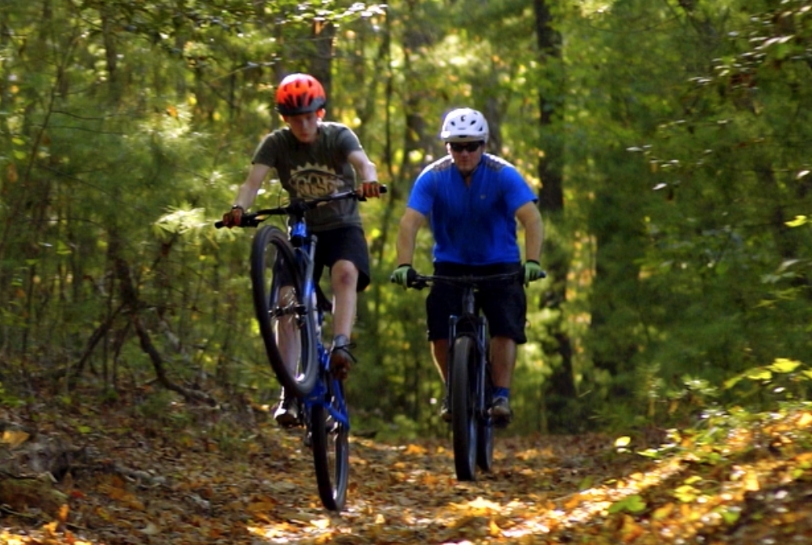 2 people mountain biking